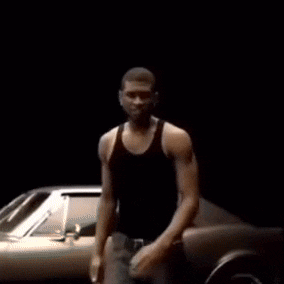 Man Dancing In Front Of Silver Car GIF