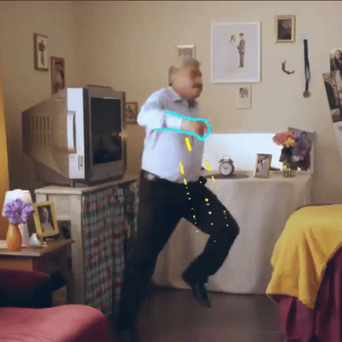 Man Dancing in Front of TV