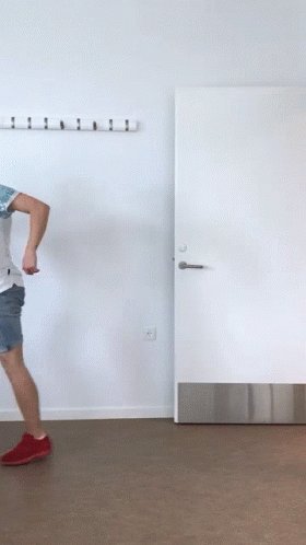 Man Dancing in Front of Yuge Sign