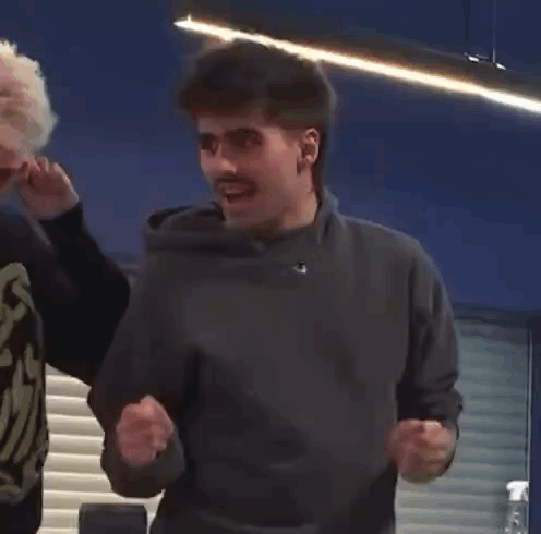 Man Dancing in Gray Sweater