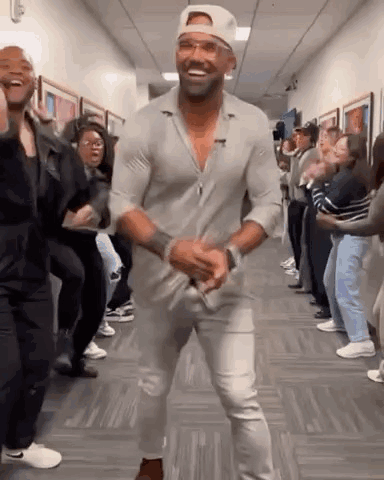 Man Dancing in Hallway Crowd