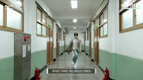 Man Dancing in Hallway