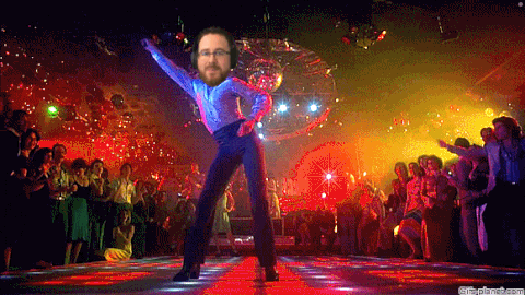 Man Dancing in Night Club with Disco Ball