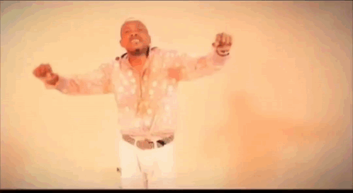 Man Dancing In Polka Dot Shirt And White Pants GIF