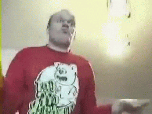 Man Dancing in Red Shirt With Bear