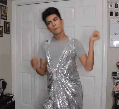 Man Dancing in Silver Sequin Dress
