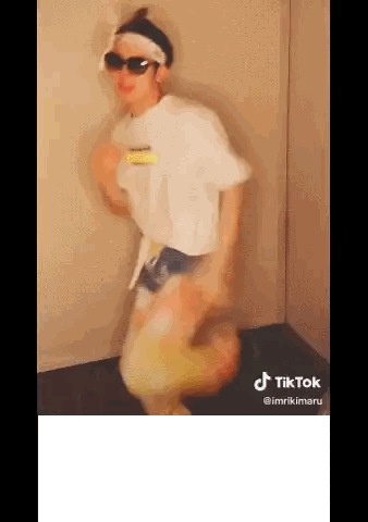 Man Dancing in Sunglasses and Headband