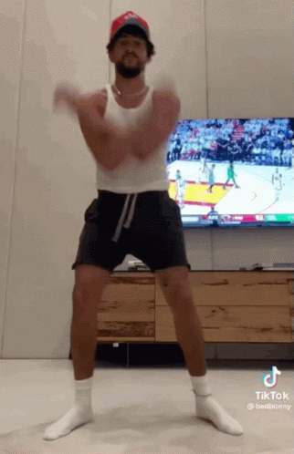 Man Dancing in Tank Top and Shorts