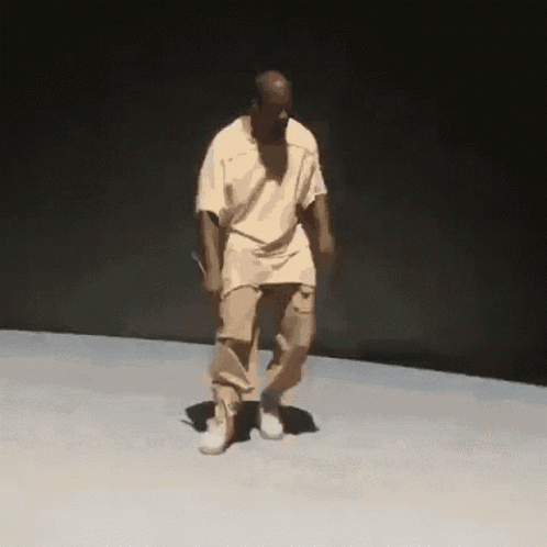 Man Dancing in White Shirt and Khakis