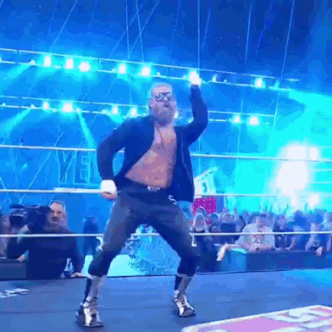Man Dancing in Wrestling Ring with Crowd