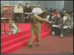 Man Dancing on Red Carpet for Crowd