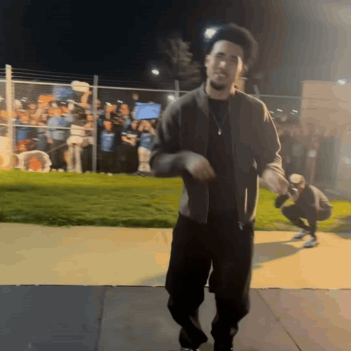 Man Dancing on Sidewalk