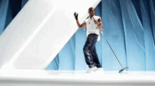 Man Dancing On Stage With Mop GIF