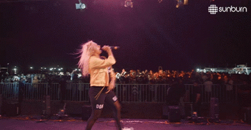 Man Dancing on Stage with Sunburn Logo