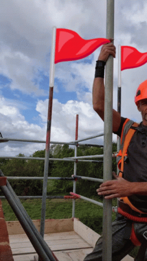 Man Dancing Red Flag Behind GIF