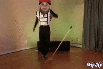 Man Dancing with Broom