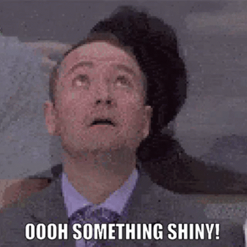 Man Distracted By Shiny Thing GIF