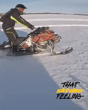 Man Doing A Snowmobile Wheelie GIF