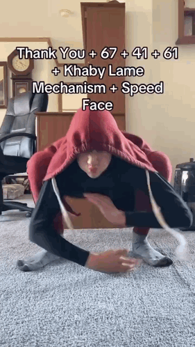 Man Doing Floor Trick With Red Hoodie