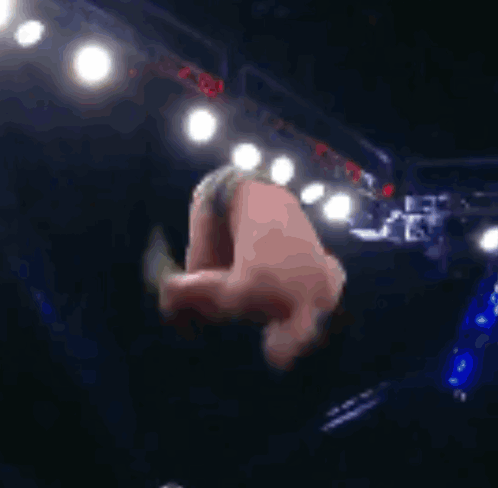 Man Doing Handstand In Dark Room With Lights GIF