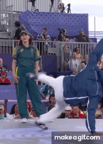 Man Doing Handstand in Front of Crowd