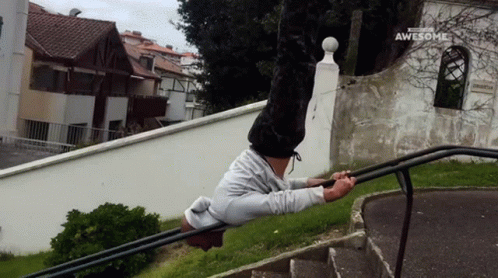 Man Doing Handstand on Railing Saying Awesome
