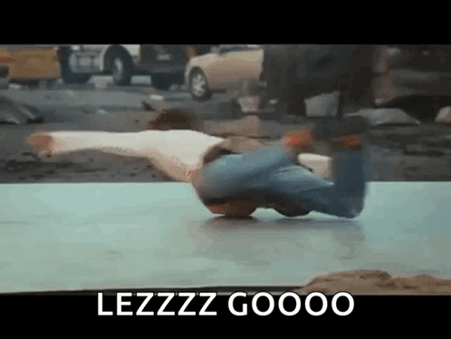 Man Doing Handstand on Table with Lezzz Gooo