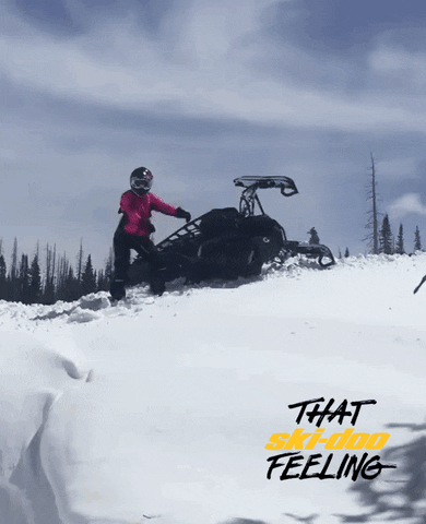 Man Doing The Floss Beside His Snowmobile GIF