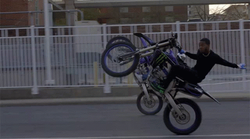 Man Doing Trick on Dirt Bike With Monster Energy Drink