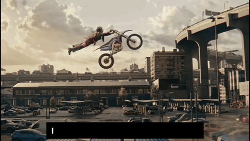 Man Doing Trick on Dirt Bike With Number 1