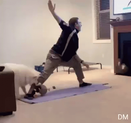 Man Doing Yoga in Living Room as Dog Watches