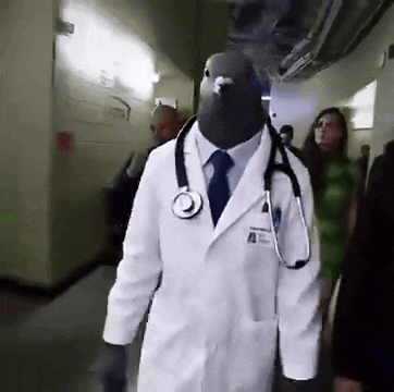 Man Dressed as Doctor with Pigeon Head