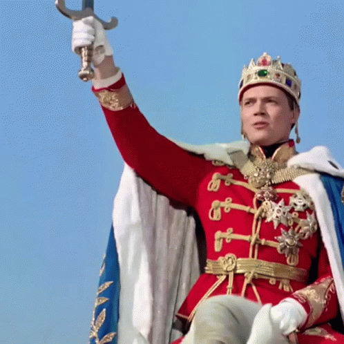 Man Dressed as King Holding Sword