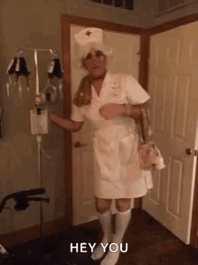 Man Dressed as Nurse Saying Hey