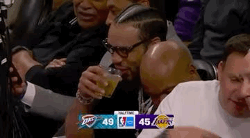 Man Drinking Beer Watching Basketball Game In Stands GIF