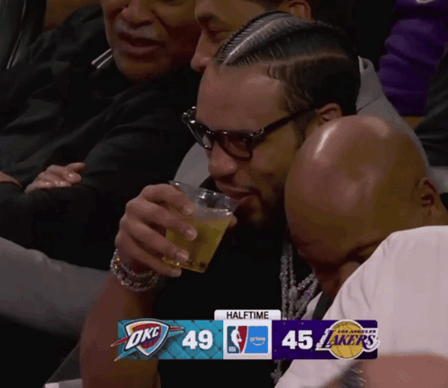 Man Drinking Beer Watching Game