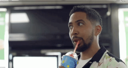 Man Drinking Dairy Queen Beverage with Straw