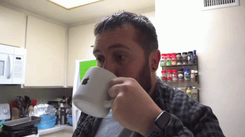 Man Drinking from Apple Logo Cup