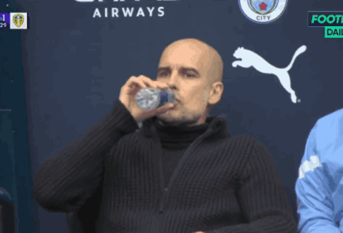 Man Drinking From Bottle in Front of Airways Logo