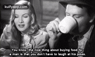 Man Drinking From Cup While Woman Looks On
