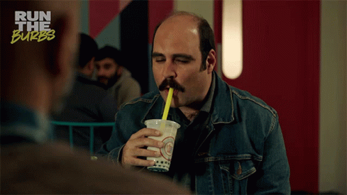 Man Drinking From Cup With Yellow Straw GIF