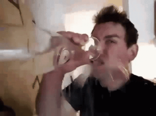 Man Drinking from Glass