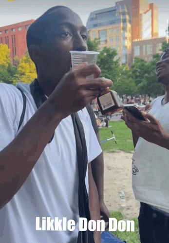 Man Drinking from Likkle Don Don Cup