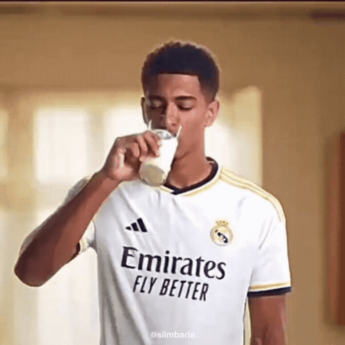 Man Drinking Milk in Emirates Fly Better Jersey