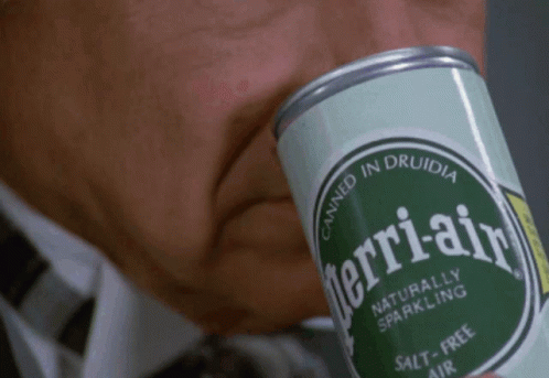 Man Drinking Perrier Air