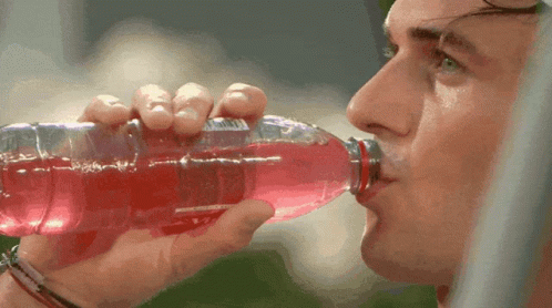Man Drinking Red Liquid