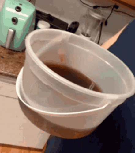 Man Drinking The Tea In Bucket GIF