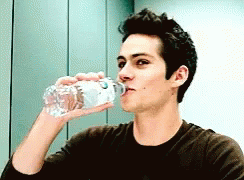 Man Drinking Water From Plastic Bottle