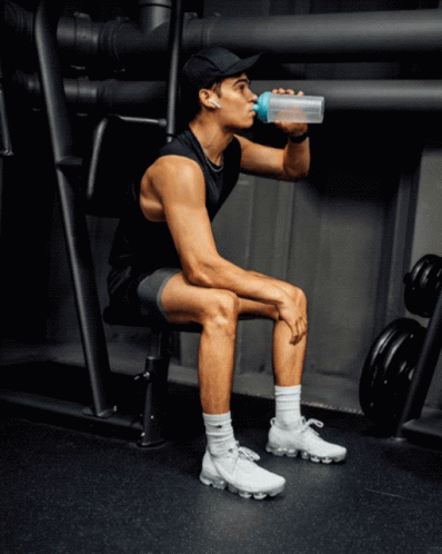 Man Drinking Water On Bench GIF
