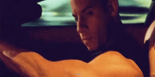 Man Driving Car Arms Outstretched Looking Out Window